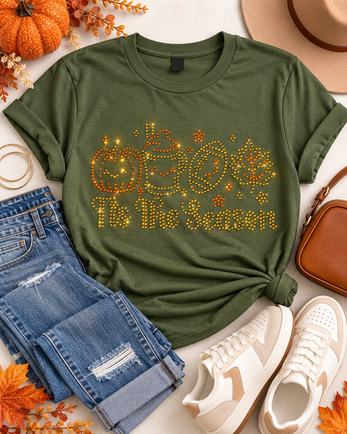 Styled flat-lay of Ready to Ship — 'Tis the Season Rhinestone T-Shirt | Olive Green Sample with jeans and sneakers
