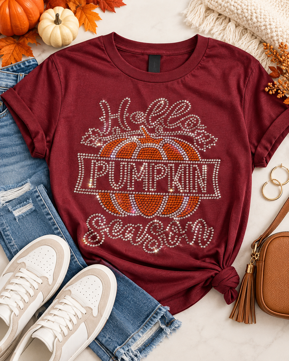 Styled flat-lay of Ready to Ship — Hello Pumpkin Season Rhinestone T-Shirt | Burgundy with jeans and sneakers