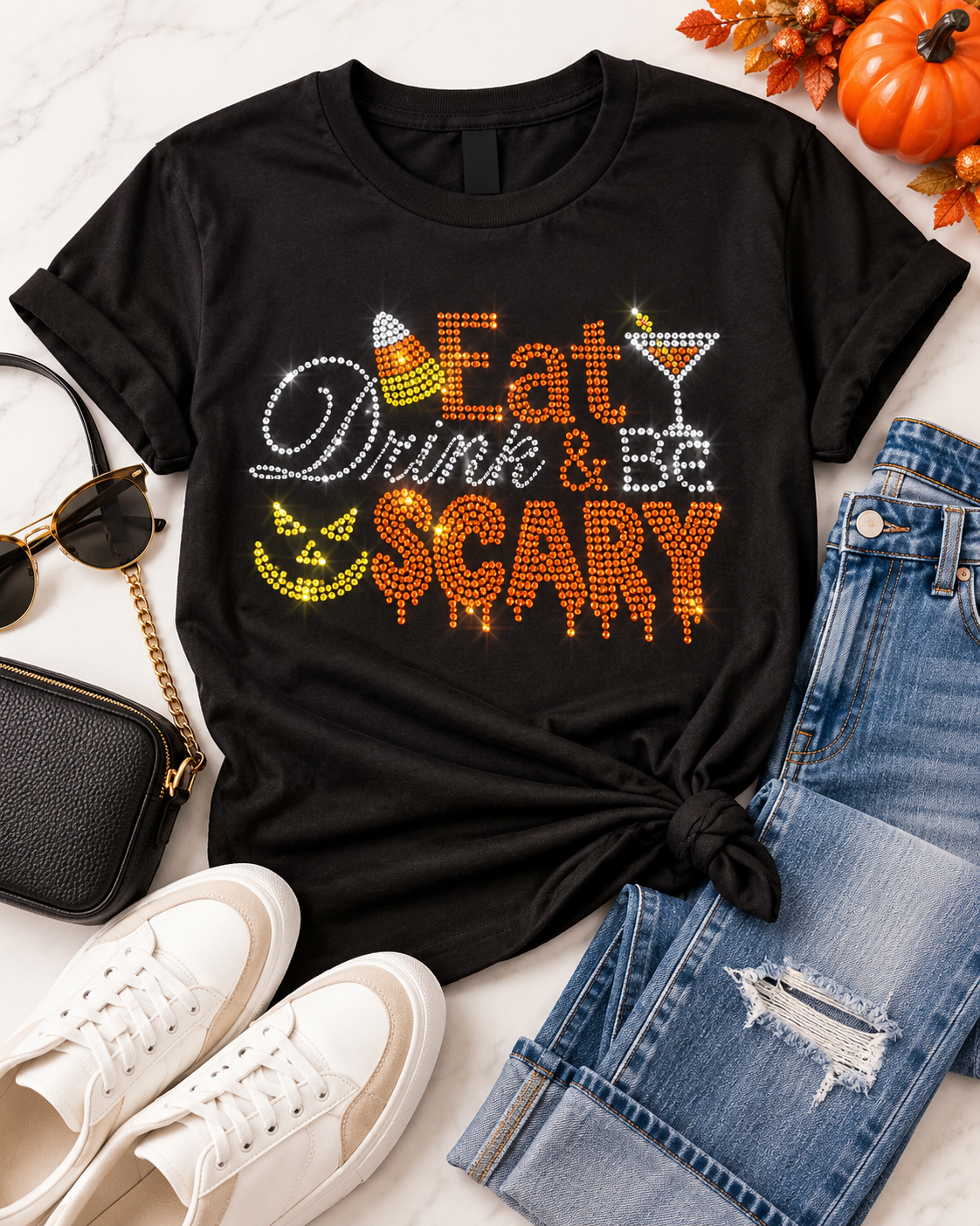 Styled flat-lay of Ready to Ship — Eat, Drink & Be Scary Rhinestone T-Shirt | Black with jeans and sneakers