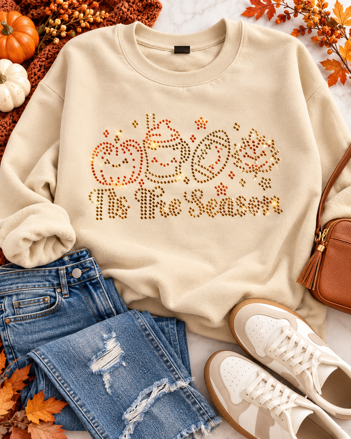 Styled flat-lay of Ready to Ship — 'Tis the Season Rhinestone Sweatshirt | Tan with jeans and sneakers